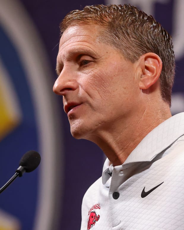 Razorbacks coach Eric Musselman at the podium for SEC Media Day on Wednesday